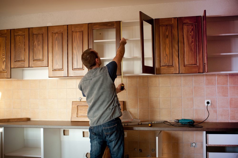 Carpenter working on new kitchen cabinets